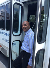 Load image into Gallery viewer, Photo of Charleston Black History Historian, Al Miller standing in the door of his tour bus. He offers the best Charleston Black History Tour, Charleston Gullah History Tour, and Charleston African American History Tour, Charleston Gullah Geechee Tour